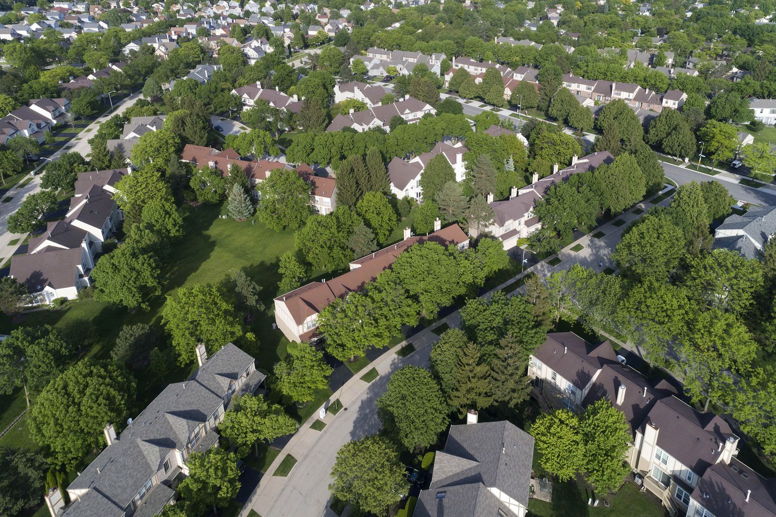 Aerial view of townhouses and single-family homes in a western suburb